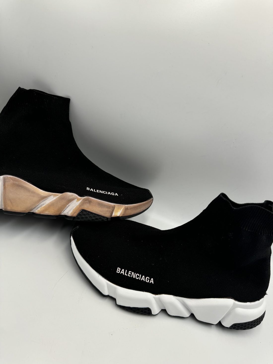 A pair of freshly cleaned Balenciaga sock trainers photographed in the Sneakersldncleans studio